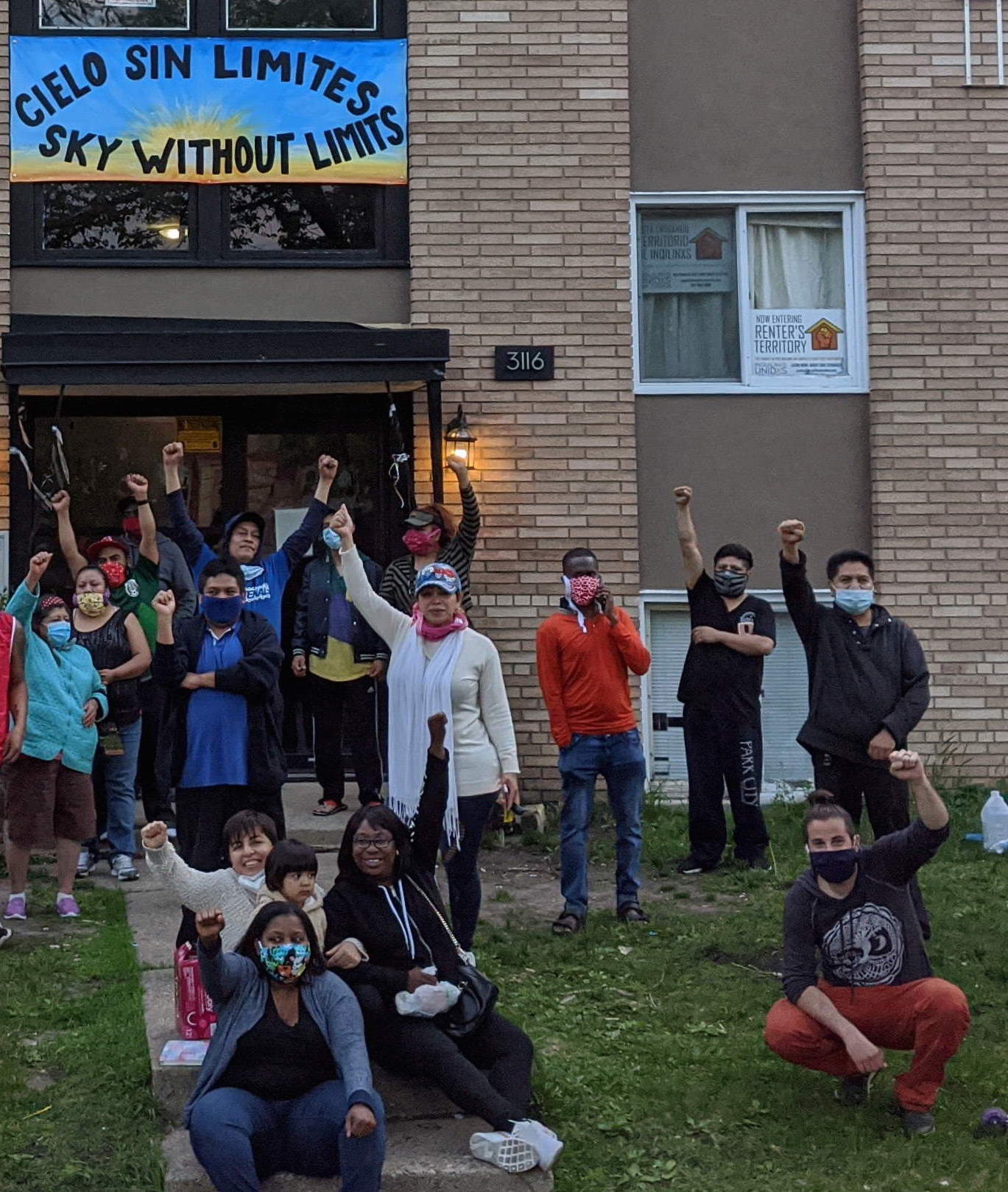 people-protesting-in-front-of-apartment-building