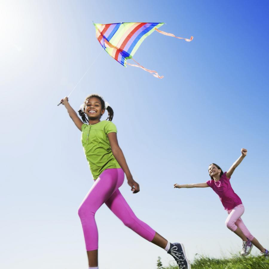 girl-waving-kite