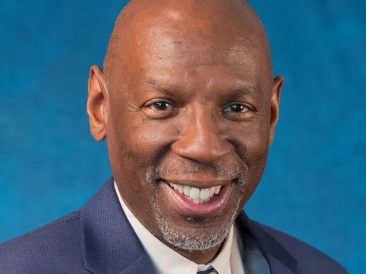 male wearing blue suit, white shirt